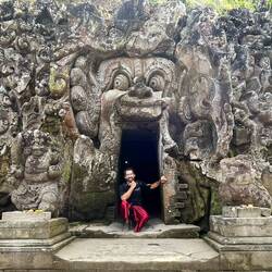 Me posing at the entrance of a cave at Goa Gajah