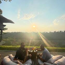 Rico and I toasting to the sunset at the Mandapa Ritz Carlton