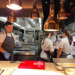 Kitchen team prepping for the next seating
