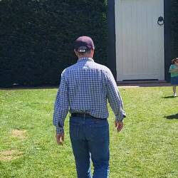 Brian walking to the door.