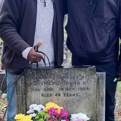 Brothers at their father's grave