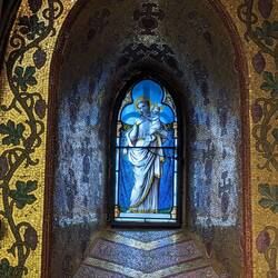 Stained glass window inside the crypt chapel