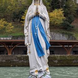 Statue in front of candles