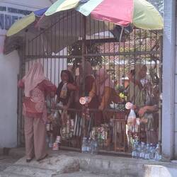 women sell food to travellers at one station. many got out to buy some.