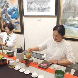Two tea master serving tea (chinese tea ceremony)