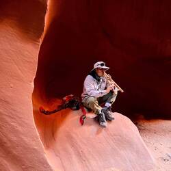 Eger playing the flute