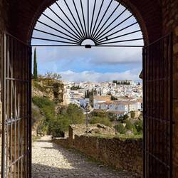View through the gate into the medina — Ronda, Spain.