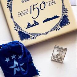 In addition to receiving our 3-Star Mariner loyalty pins today, we received Delft tile coasters.