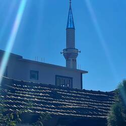 Perfect photo of a blue minaret in the sun