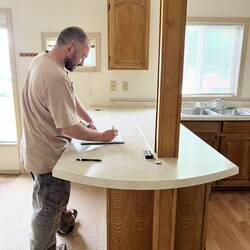 Brice was the only person that agreed the ceiling could be lofted. Here he is drawing and thinking.