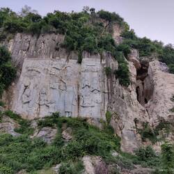 Carvings and entrance to the Bat Cave at Phnom Sampow