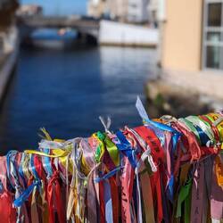 Friendship ribbons on a bridge over a canal