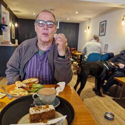 Charlie & Co dog cafe with Arlo the doberman behind Will