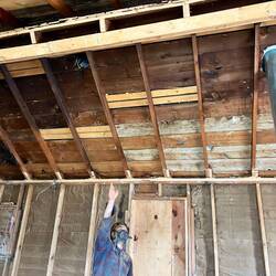 Brice explains how the beams support the open space.