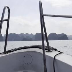 tiny boat brings us to Cat Ba Island