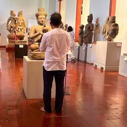 people pray in museum (he kneed down afterwards)