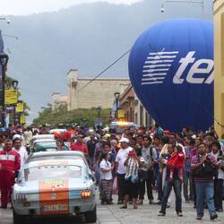 The PanAmerican Rally was passing through. Apparently the car the beat is the Studebaker.