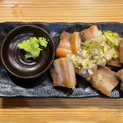 Grilled pork belly with chopped spring onions and wasabi in Amami-Oshima