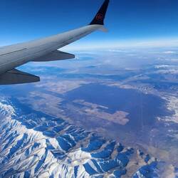Beautiful snow capped hills, farms and a dry lake (Nevada?)