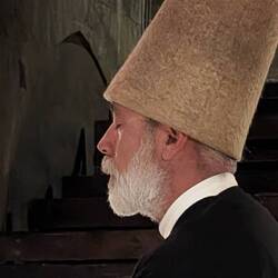 The leader of the Dervishes. His voice was deep and soothing