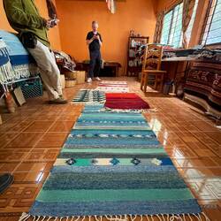A selection of rugs in a family owned store in Tiotitlan