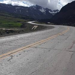 Back on the bike. Up, up and against the wind