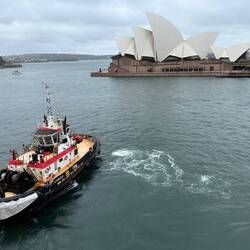 The tugs pull us out from the Quay.