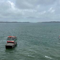 The pilot boat and tenders returning towards the end of the day.