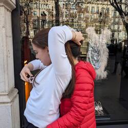 Apparently this position is required to fix her mother's hair