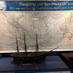 Early map and model ship