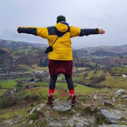 Bracing against the wind on top of the hill