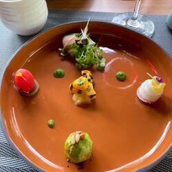 Small bites like lotus with passion fruit, tomato, brussel sprout