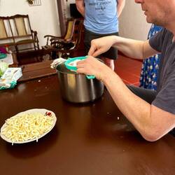 Preparing fresh coconut for the dessert