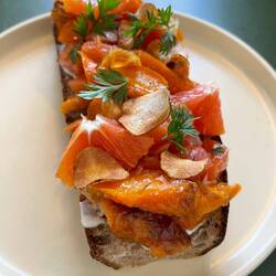 Salmon tartine with citrus and carrots and cheese