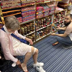 Lee choosing from wide variety of colourful shoes.