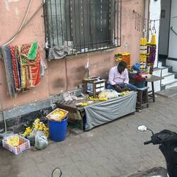 Along the way. Flowers play a large part in life and religion in India.