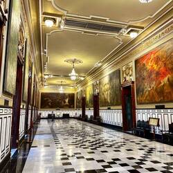 State room with paintings on history of Merida