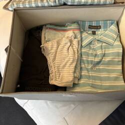 Laundry delivered back in a box, all neatly folded.