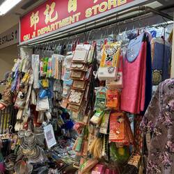 The sign above this stall says " Department Store".