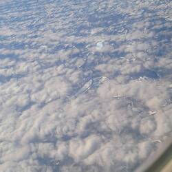 Through the clouds, snow.