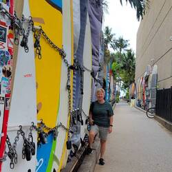 The surf boards were lined up & outside Waikiki Beach