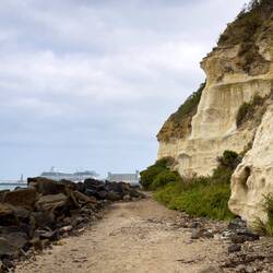 A breakwater of boulders protects us from the surf as we round Whaler's Point — Portland, VIC.