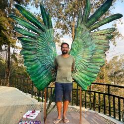 Me posing in front of angel wings at the "Cerro de la Cruz"