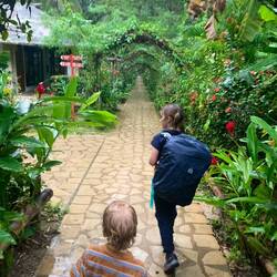 Soaking wet from a downpour wandering to our jungle lodge watching out for creepy crawlies!