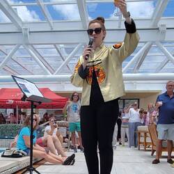 Cruise Director toasting the Crew