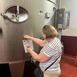 Drawing off some young wine from one of the large tanks