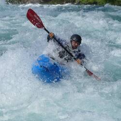 The best thing about rafting here is watching the safety kayakers dancing through the waves