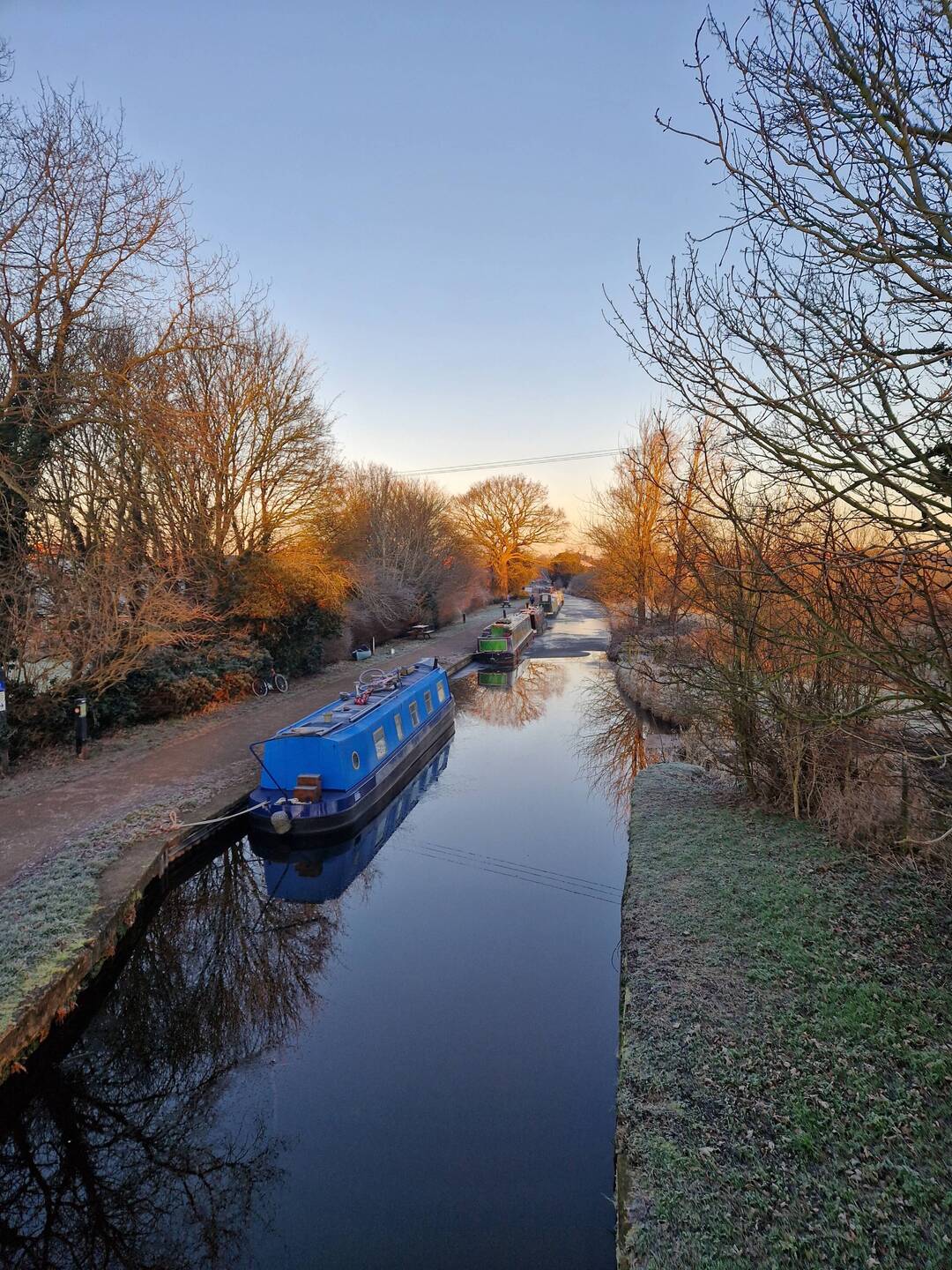 Rainboat moored behind The Black Cat, taken from the bridge