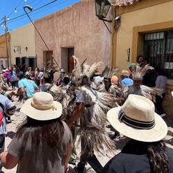 Men in ostrich feathers to honor Pachamama
