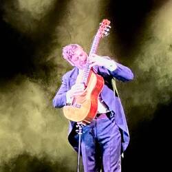 His fingernails are his picks.